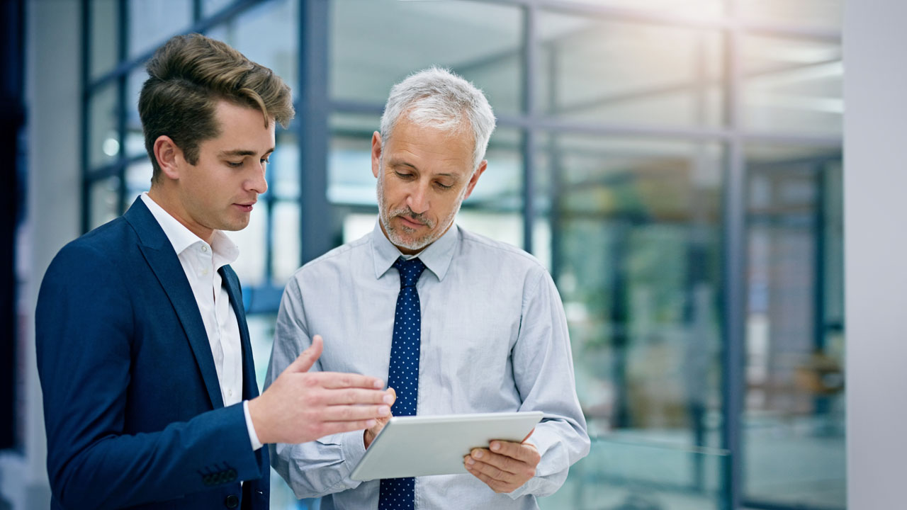 financial advisors reviewing document